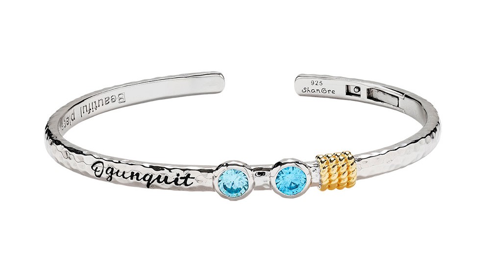 A bracelet that says "Ogunquit"