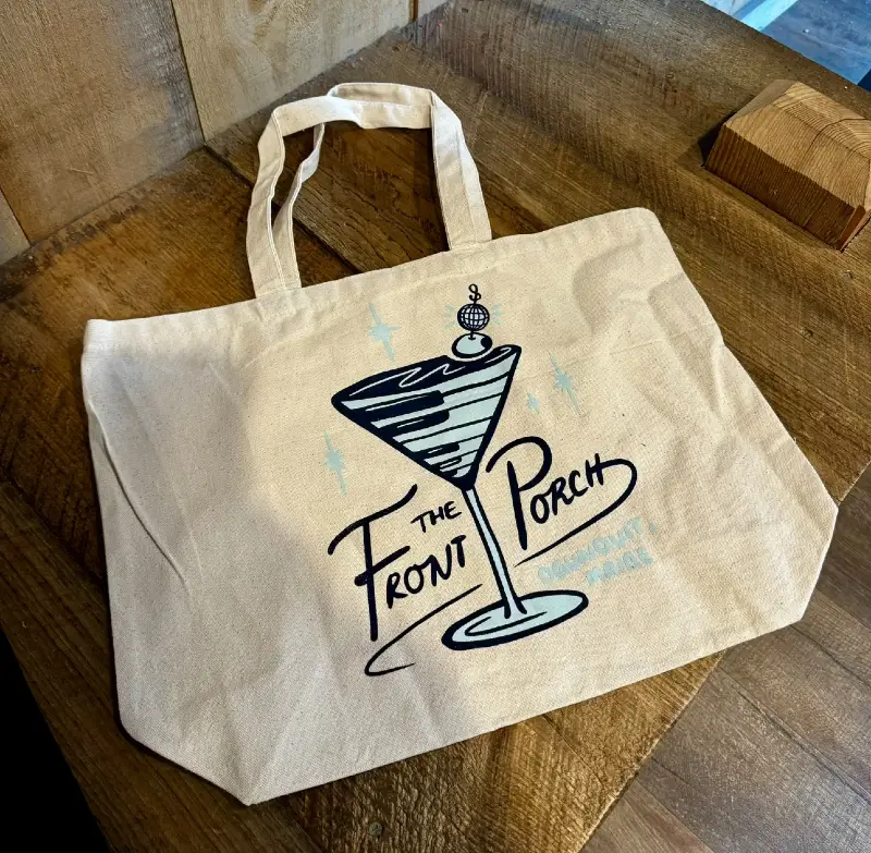 A canvas tote bag that says "Front Porch"